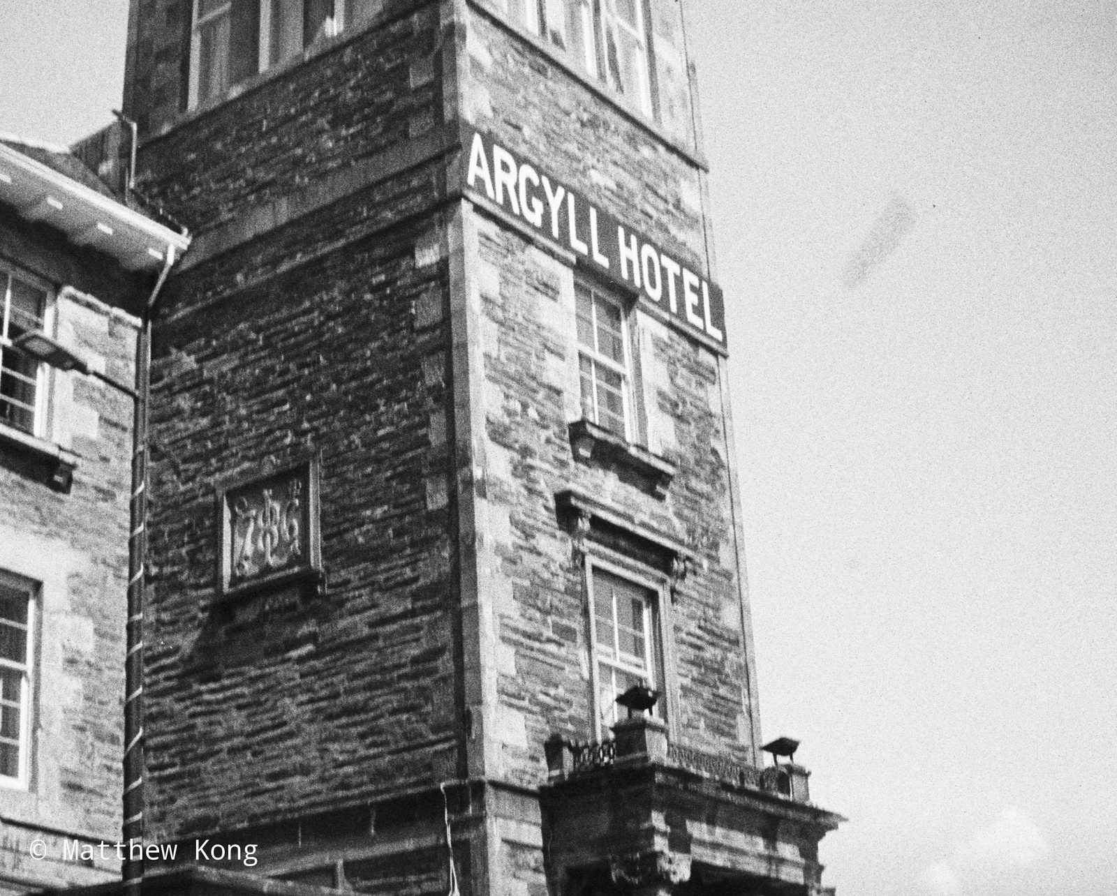 The stone corner of the Argyll Hotel, its name in white capitals along the parapet.